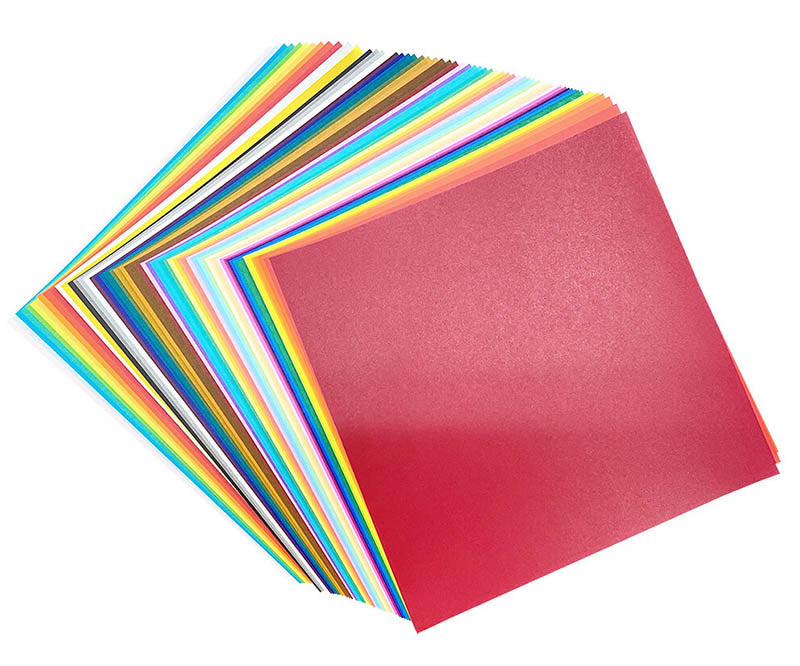 A stack of colorful cardstock sheets fanned out on a white background, with a red sheet prominently displayed on top.